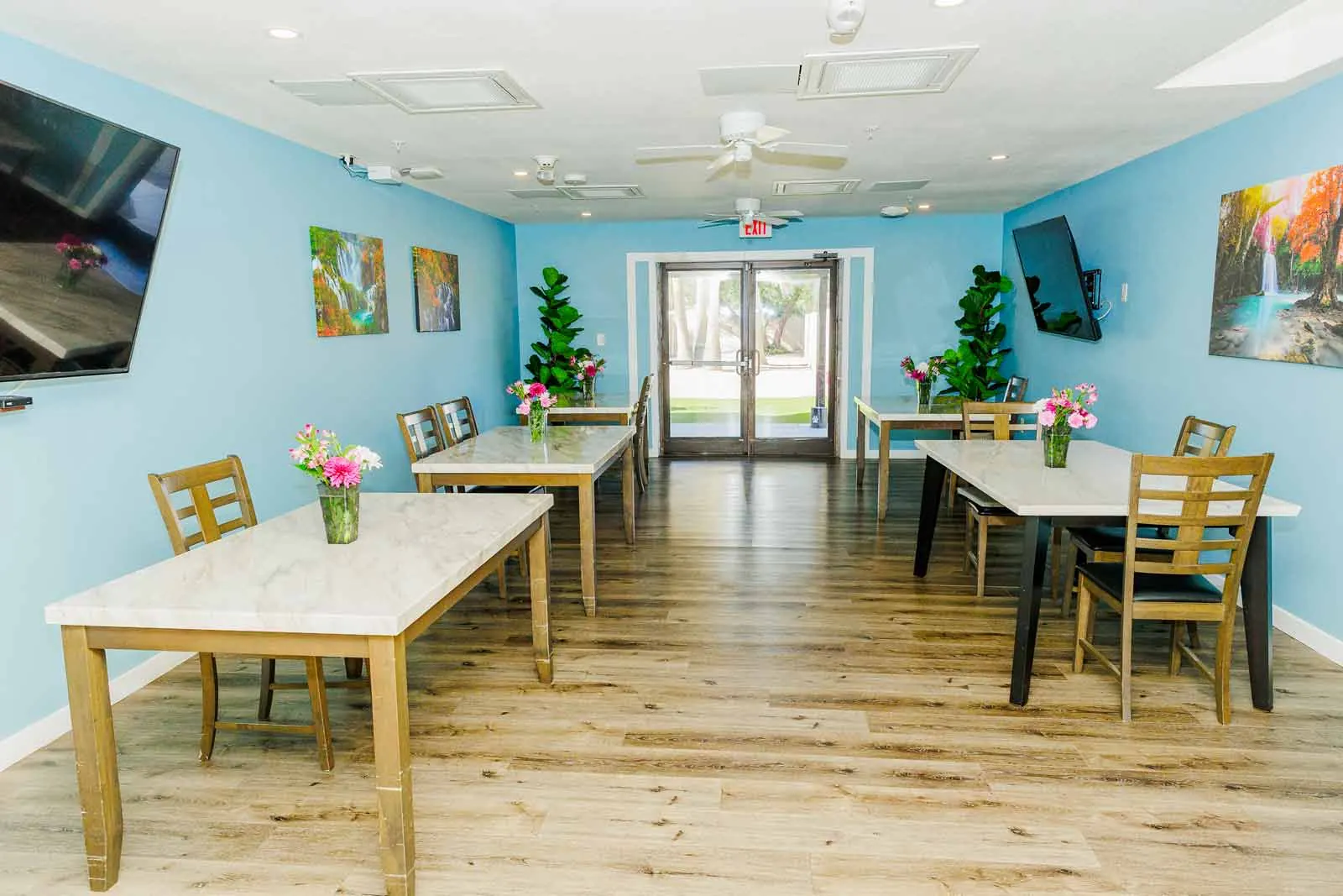 Bright dining room with flowers on every table